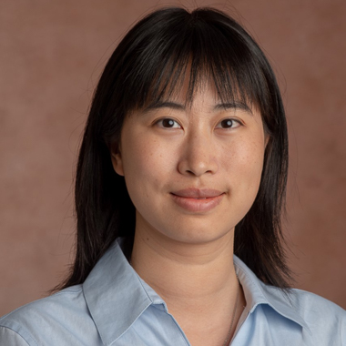 Yu Zhang sits for a formal portrait. 