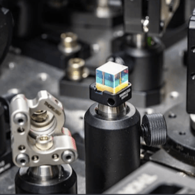 A close-up of a beam-splitter cube among the Harel Group’s laser instrumentation. Using short pulses of light, Harel can produce a molecular movie that captures the vibrational motion of a biological object based off its “sound.”