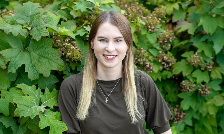 MGI doctoral student Julia Kelliher smiles at the camera.