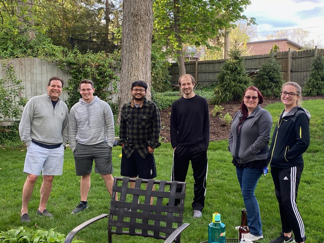 Group of people standing in Vic's backyard